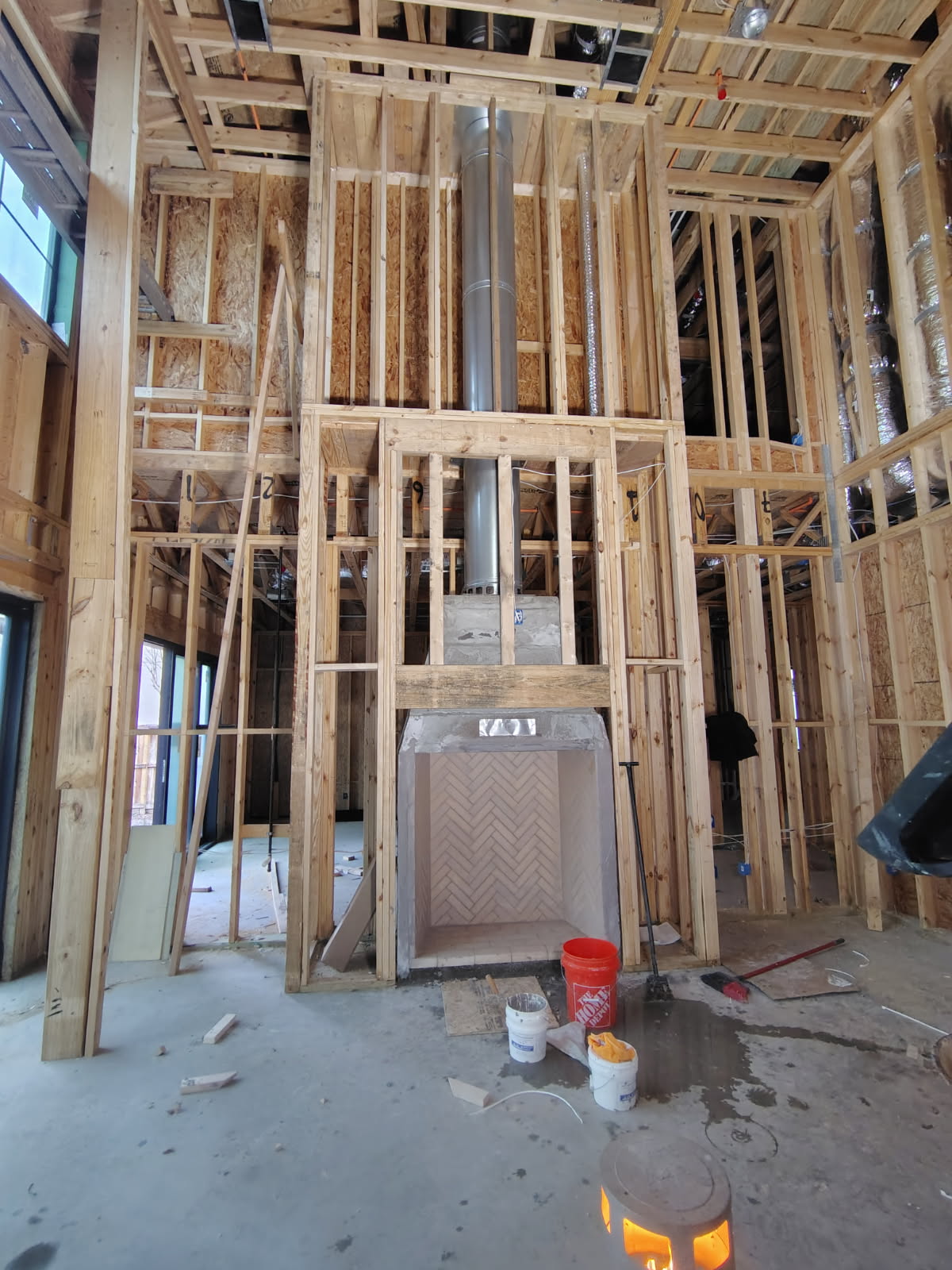 New-construction fireplace and chimney chase framed in Houston, TX