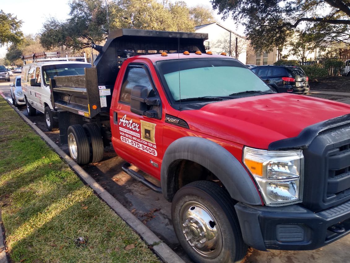 Artex Masonry & Fireplace truck and service van on a job site in Houston, TX