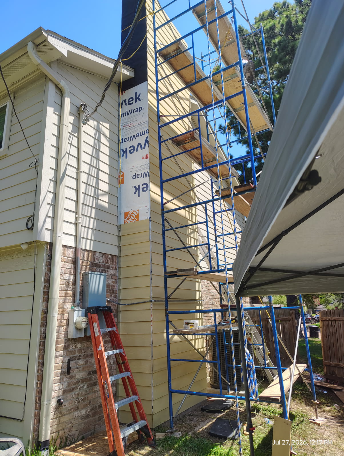 Exterior scaffolding staged for a full fireplace and chimney replacement in Houston, TX