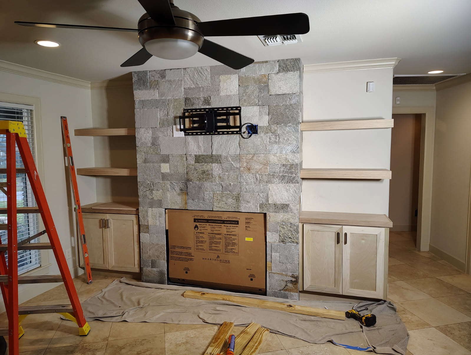 Stacked stone fireplace installation in progress in Katy, TX