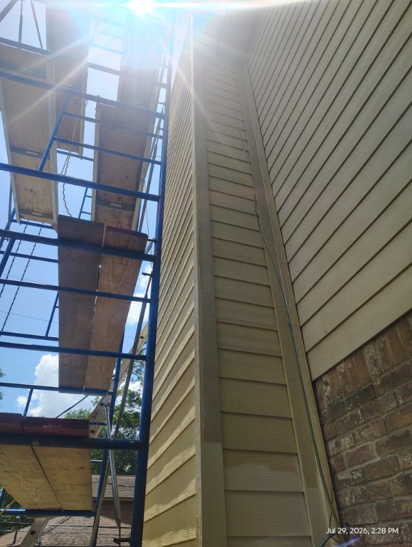 Scaffolding set for a chimney chase rebuild on a two-story Houston, TX home
