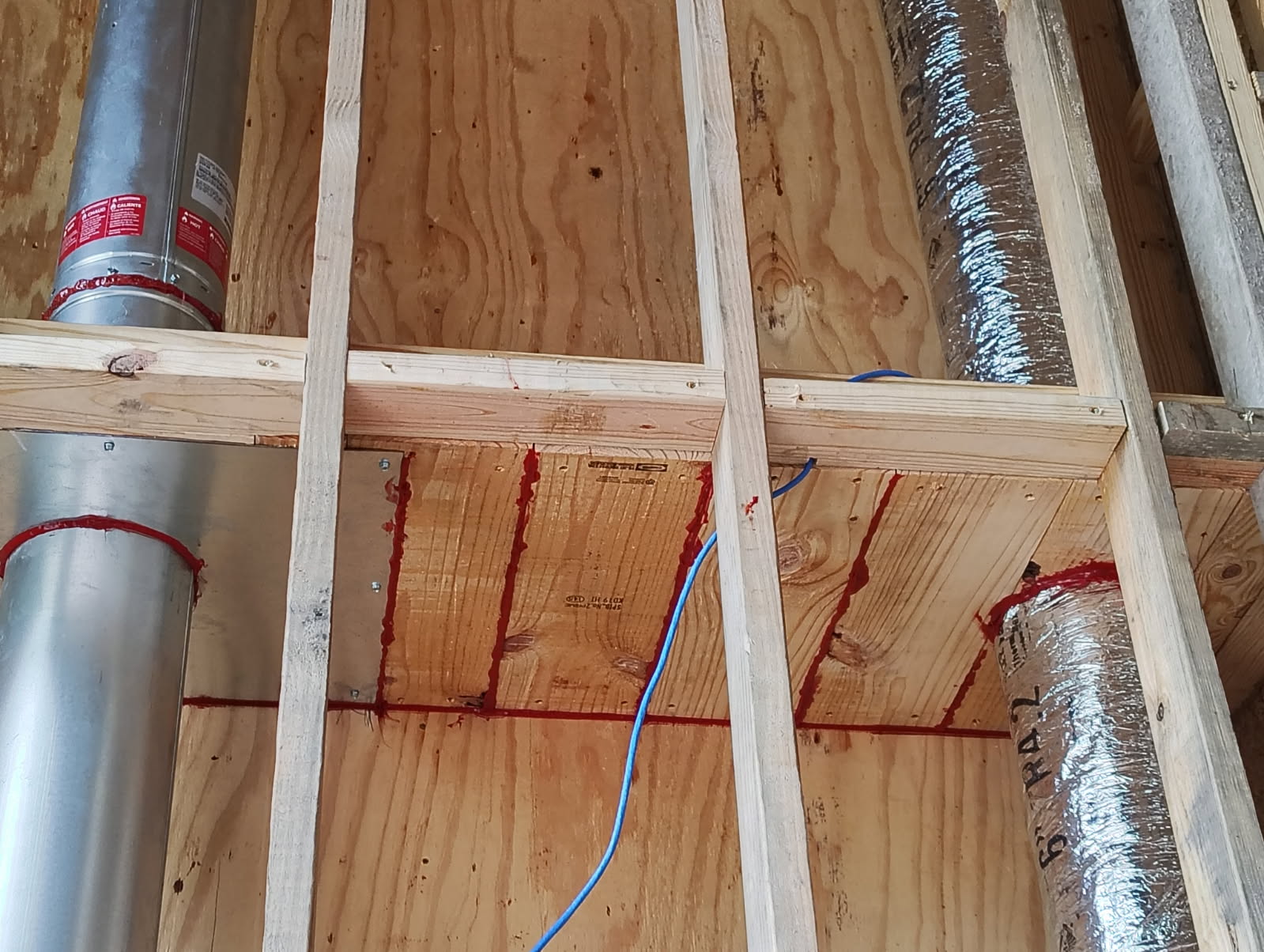 Code-compliant firestops installed around a chimney flue chase in Houston, TX