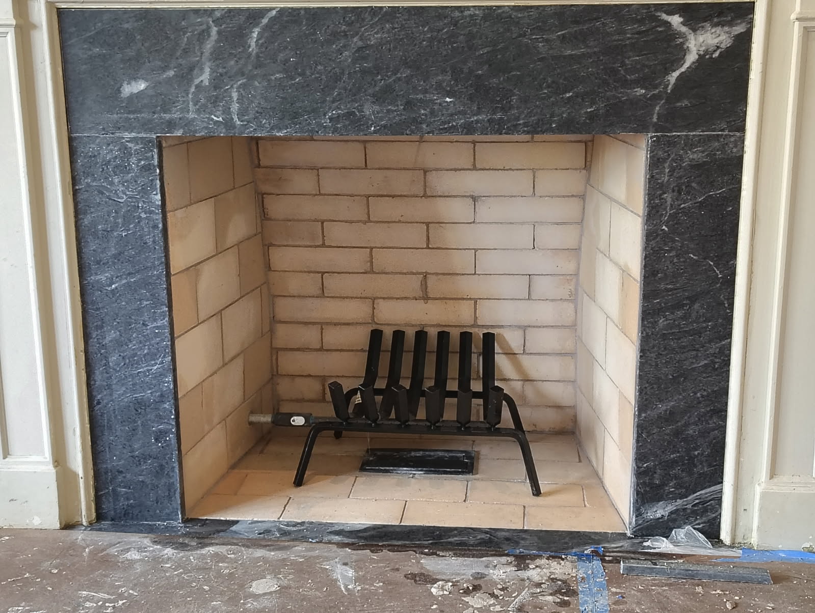 Marble fireplace surround with a new firebrick firebox in Houston, TX