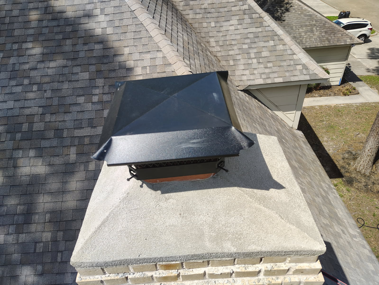 New chimney chase cover and crown installed on a Houston, TX rooftop