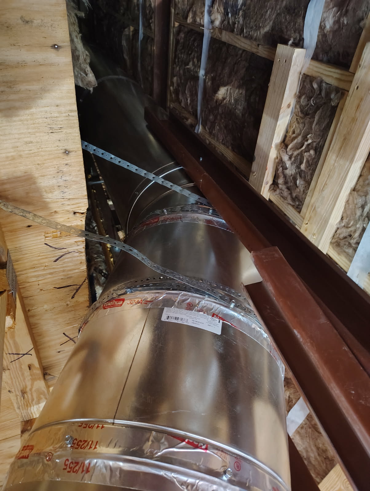 Stainless chimney flue liner sections staged for installation in Houston, TX