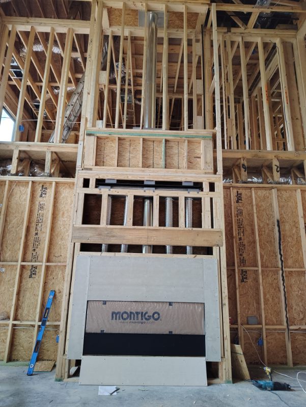 Montigo linear gas fireplace framed into a two-story chase during new construction in Houston, TX